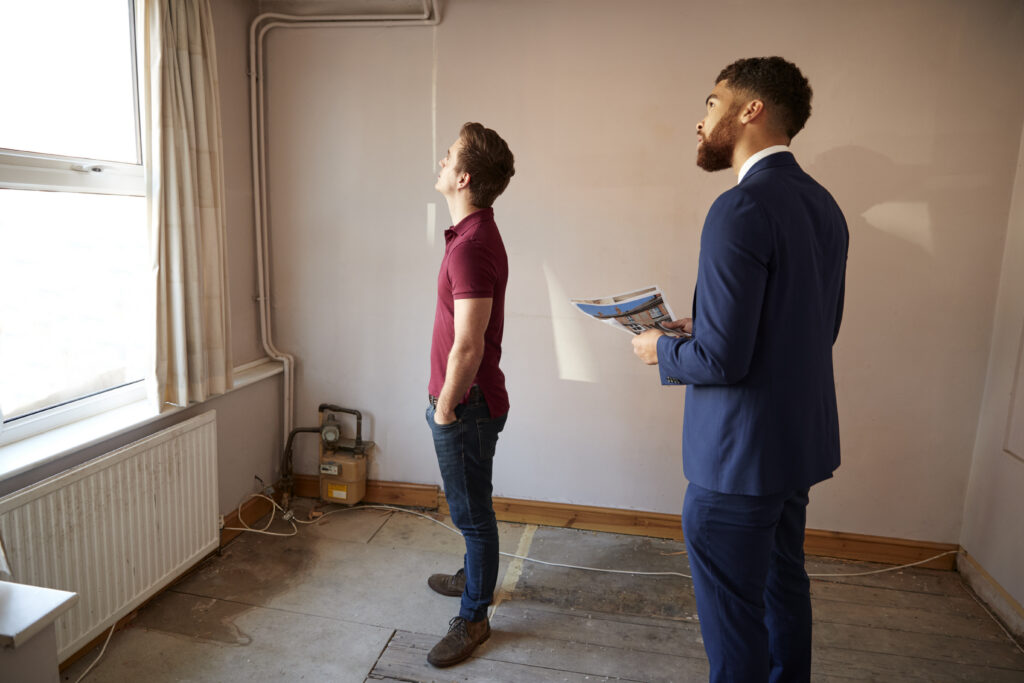 Man looking at an inherited old property